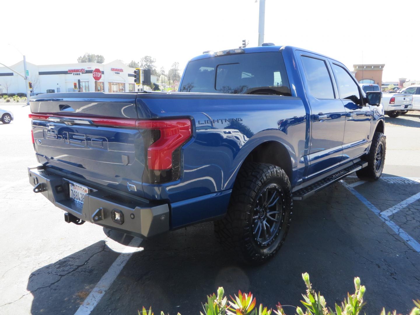 2022 BLUE /BLACK Ford F-150 Lariat Crew Cab 4WD (1FT6W1EV6NW) , located at 2630 Grass Valley Highway, Auburn, CA, 95603, (530) 508-5100, 38.937893, -121.095482 - Tired of gas prices and still want to look cool? Check out this Ford Lightning featuring a RC level kit, Nitto Ridge Grappler tires, Fuel Rebel wheels, Sinister front and rear bumpers, Baja Designs leds, Rigid Industries Leds, Bakflip F1, and window tint. - Photo#4